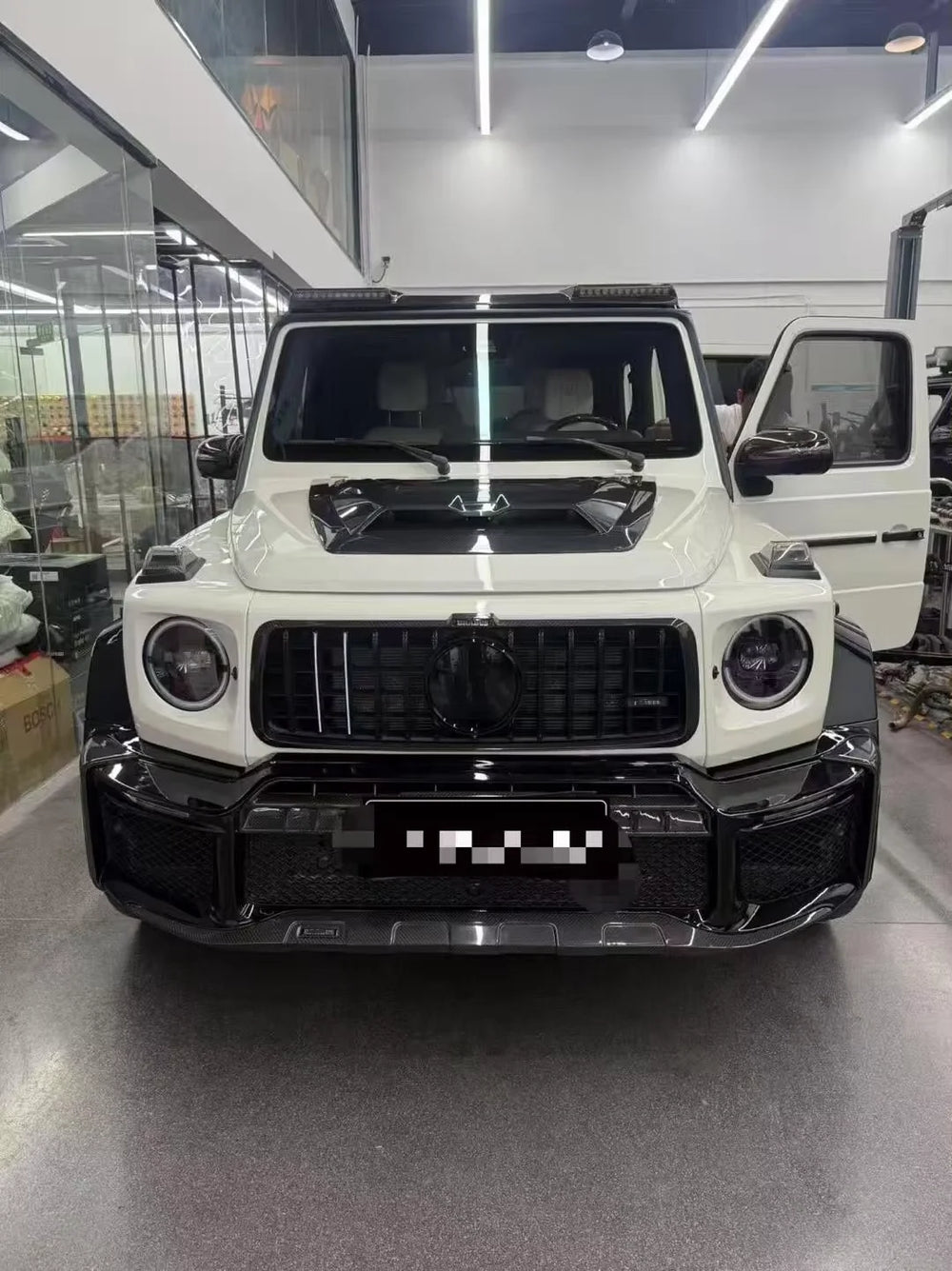 Kit carrosserie style G800 en carbone sec pour Mercedes-Benz Classe G W465 / W464 (G500 / G63) 2019, avec capot, pare-chocs et aileron